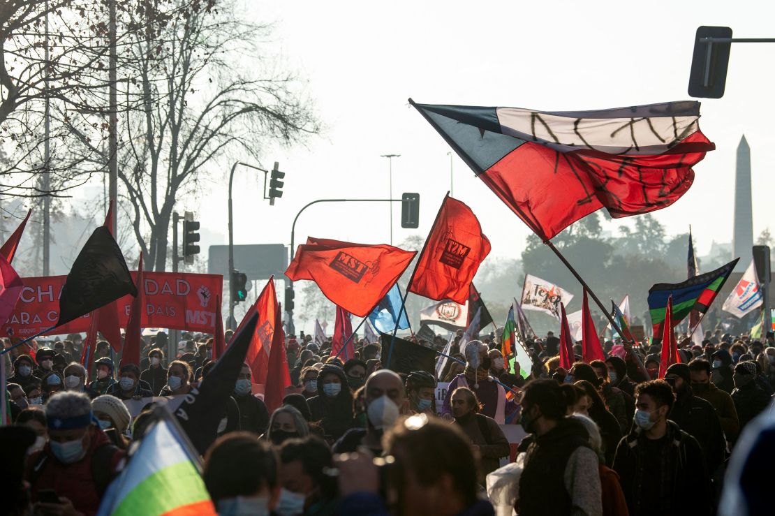 Demonstrators and elected Constituents march towards the Chilean National Congress where the Constituent Assembly would be inaugurated in Santiago, on July 4, 2021.