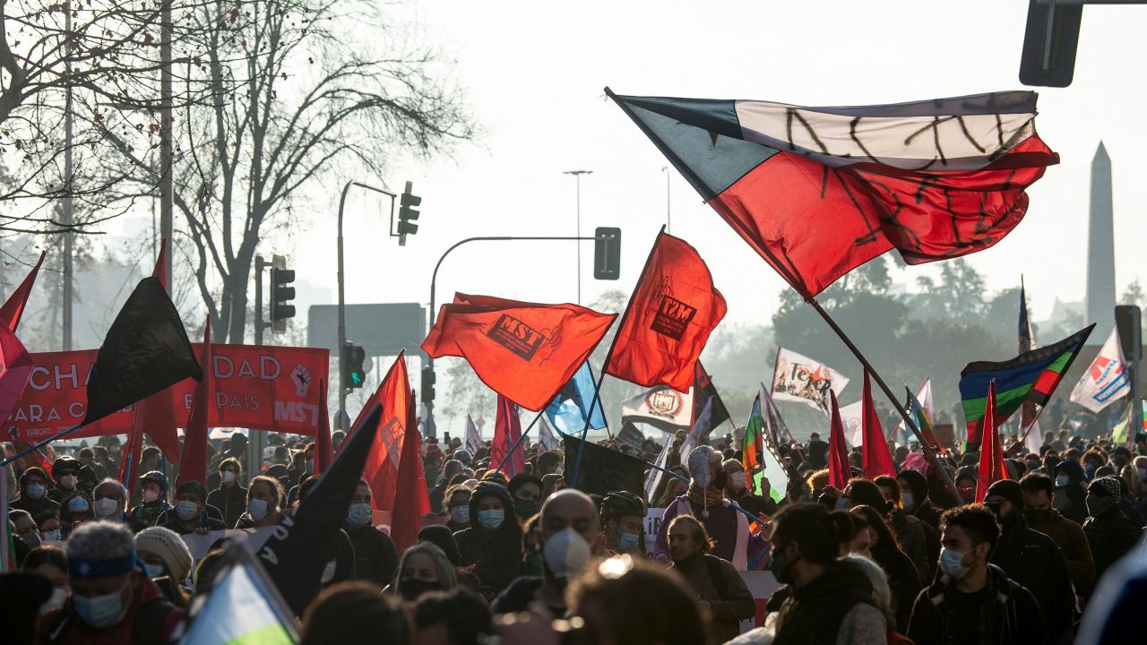 Demonstrators and elected Constituents march towards the Chilean National Congress where the Constituent Assembly would be inaugurated in Santiago, on July 4, 2021.