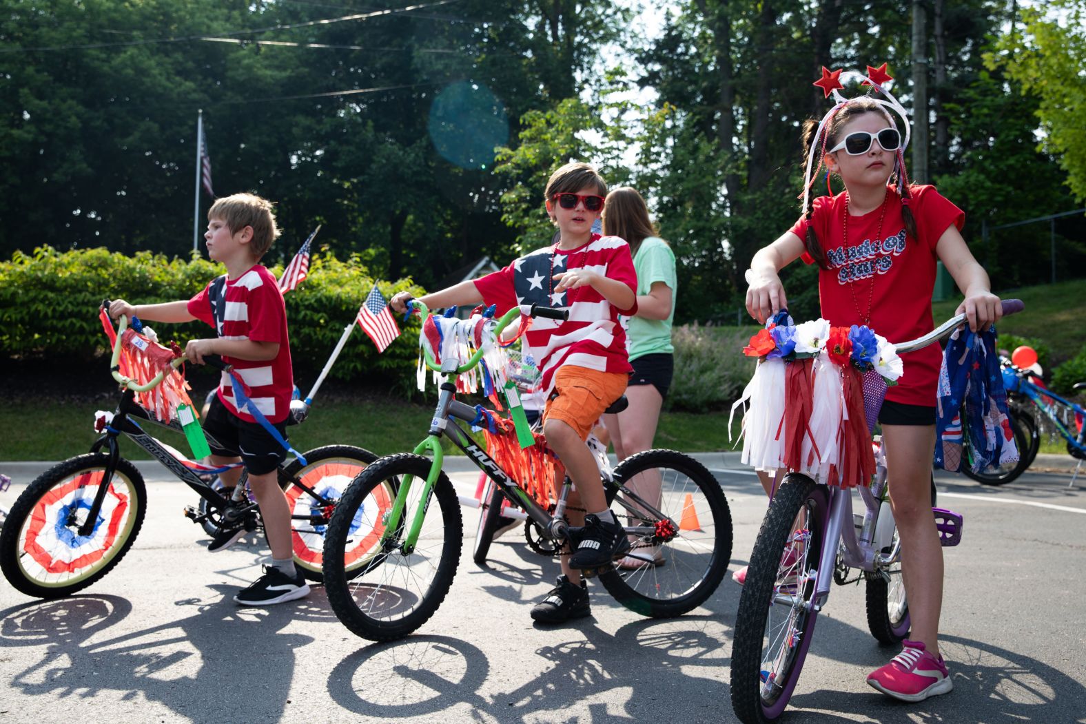 Young kids dressed up get ready to ride in an Independence Day parade celebration on July 4, in Brighton, Michigan.