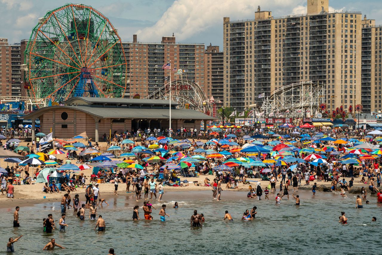 People gather at Coney Island beach in New York City on Sunday.