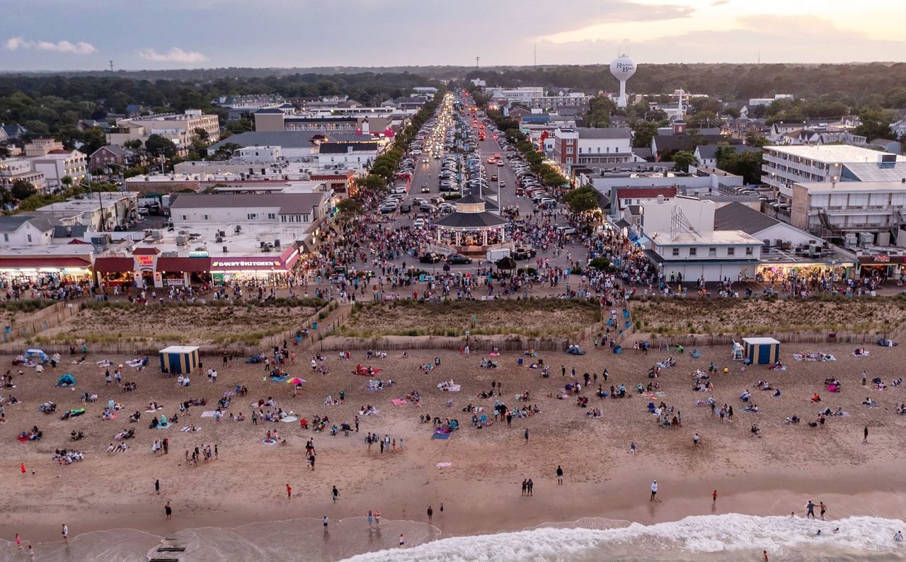 People gather at Rehoboth Beach for July Fourth celebrations on Saturday, in Delaware.