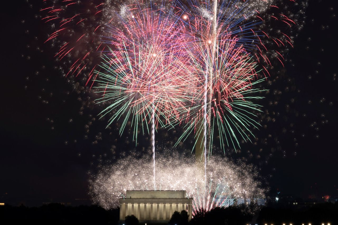 Fireworks explode over the Lincoln Memorial, Washington Monument and US Capitol, in Washington, on Sunday, July 4.