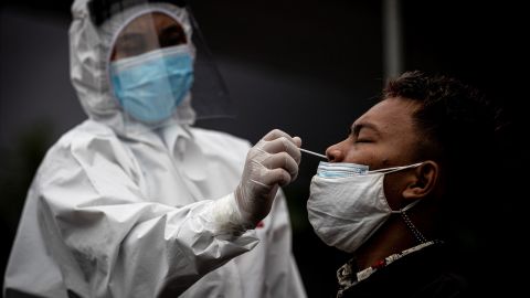 Medical staff take a Covid-19 swab antigen test in Surabaya, Indonesia, on July 3.