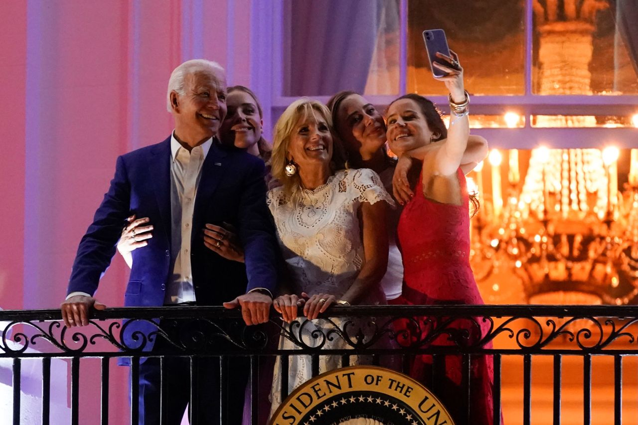 President Joe Biden poses for a selfie with granddaughter Finnegan Biden, from left, first lady Jill Biden, granddaughter Naomi Biden and daughter Ashley Biden as they view fireworks during an Independence Day celebration on the South Lawn of the White House.