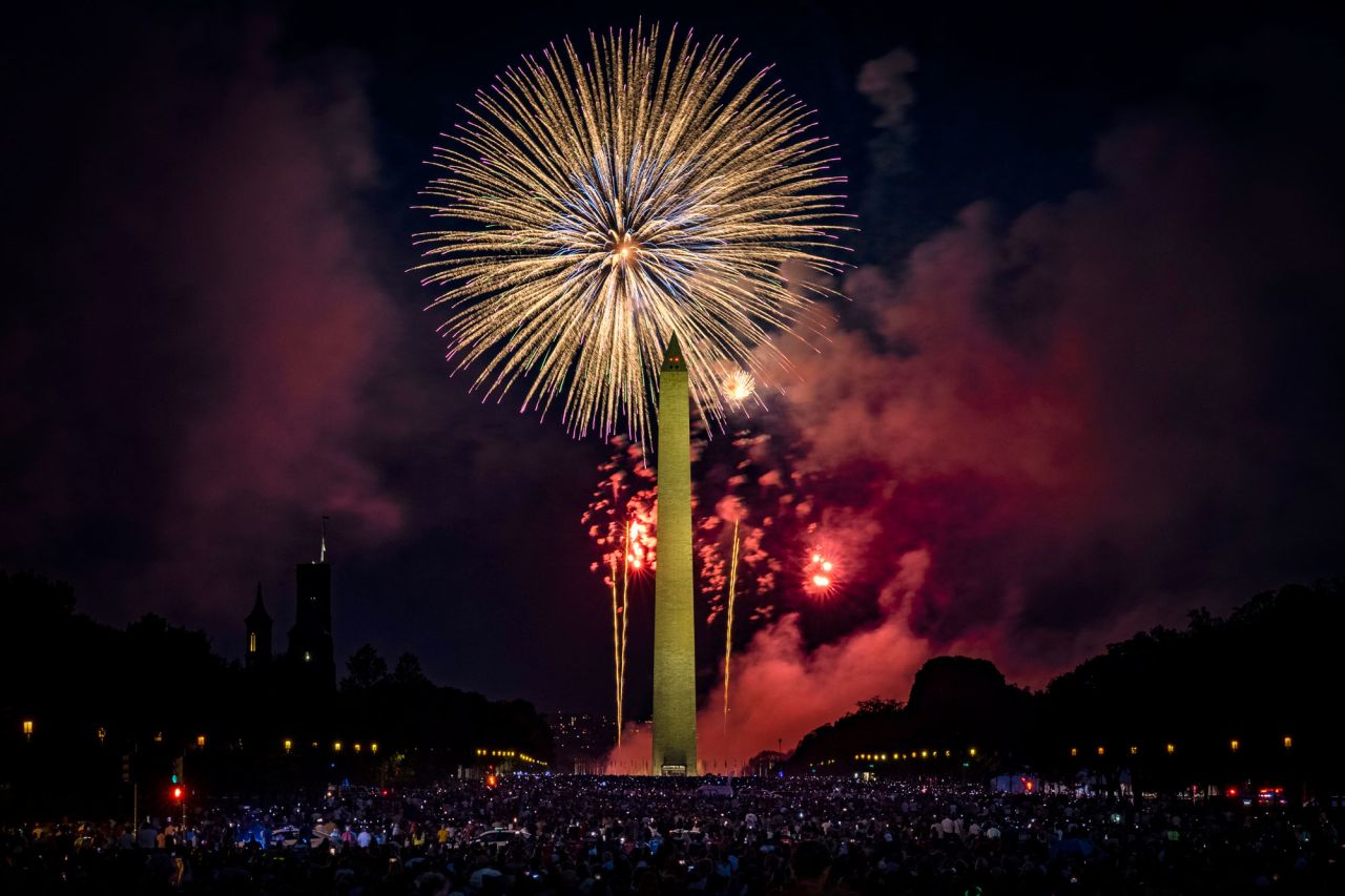 People fill the National Mall to watch the fireworks display during Independence Day celebrations on July 4, in Washington, DC. 