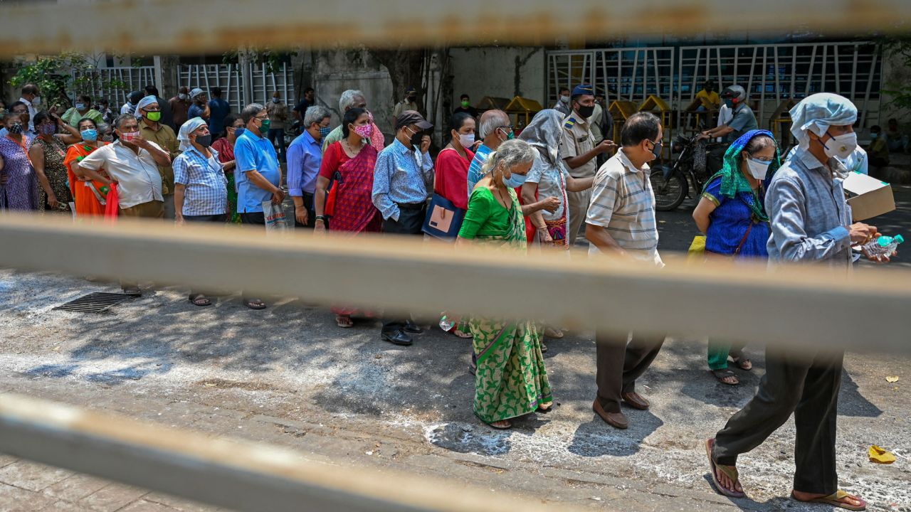 People line up to receive coronavirus vaccine shots in Mumbai, India, on May 4.