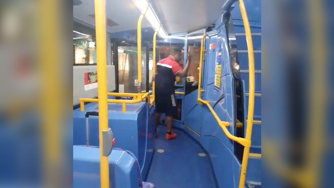 A still from the video taken on a bus in central London, showing a man berating the bus driver.