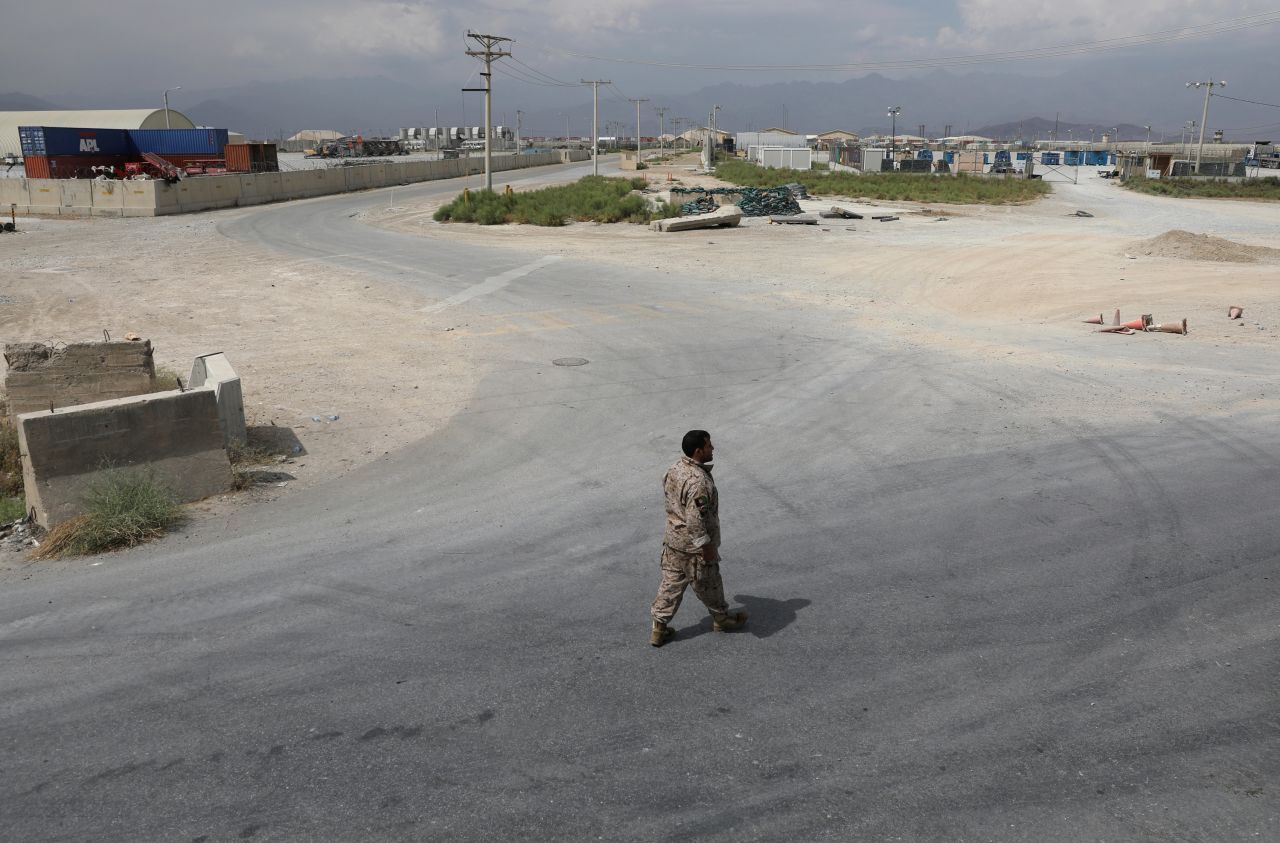 A member of Afghanistan's security forces walks at Bagram Air Base after the last American troops <a href="https://www.cnn.com/2021/07/01/politics/us-military-bagram-airfield-afghanistan/index.html" target="_blank">departed the compound</a> in July 2021. It marked the end of the American presence at a sprawling compound that became the center of military power in Afghanistan.