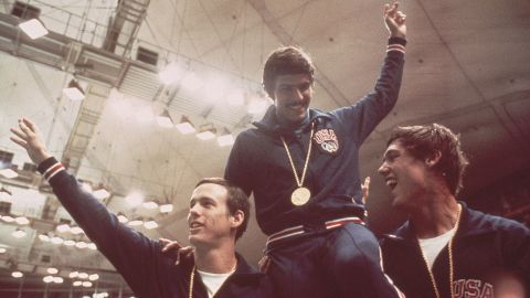 Spitz (center) celebrates relay gold at the 1972 Munich Olympics.