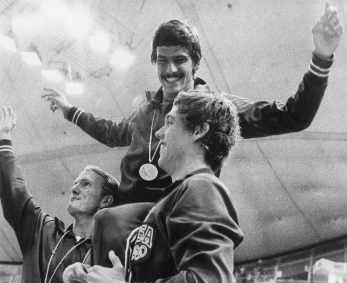 American swimmers Tom Bruce (left) and Mike Stamm (right) carry teammate Mark Spitz on their shoulders at the 1972 Olympics in Munich.