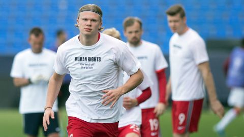 During 2021 there have even been concerns about the 2022 World Cup among players on the pitch. Norway's forward Erling Braut Haaland is pictured wearing a t-shirt with the slogan "Human rights, on and off the pitch" as he warms up before the FIFA World Cup Qatar 2022 qualification football match between Norway and Turkey at La Rosaleda stadium in Malaga on March 27, 2021. 