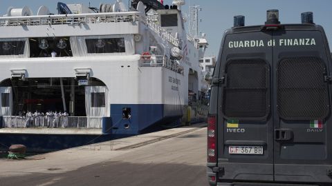 An Italian law enforcement vehicle parked next to the ship "Geo Barents" while migrants wait to disembark in Sicily on June 18.