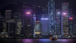 A boat sails on along Victoria Harbor past the People's Liberation Army (PLA) Hong Kong Garrison building, center and other buildings in Hong Kong, China, on Thursday July, 1, 2021. Hong Kong's leader pledged to press ahead with an unprecedented national security crackdown, as the Asian financial center marked a series of fraught anniversaries symbolizing Beijings tightening grip over local affairs. Photographer: Paul Yeung/Bloomberg via Getty Images