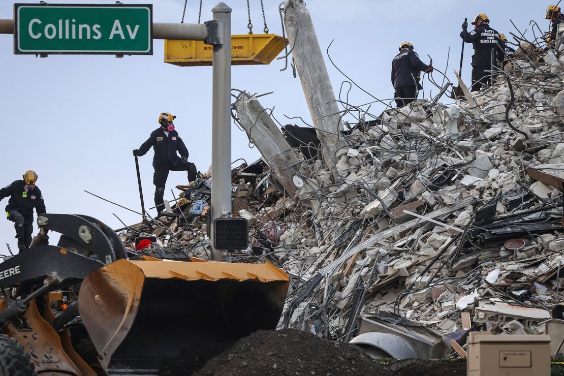 Rescuers search for victims at a collapsed South Florida condo building Monday.