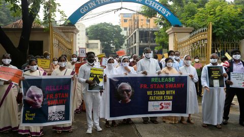 Catholic priests and nuns hold placards during an October protest against the arrest of the Rev. Stan Swamy, a Jesuit priest, in Secunderabad, India.