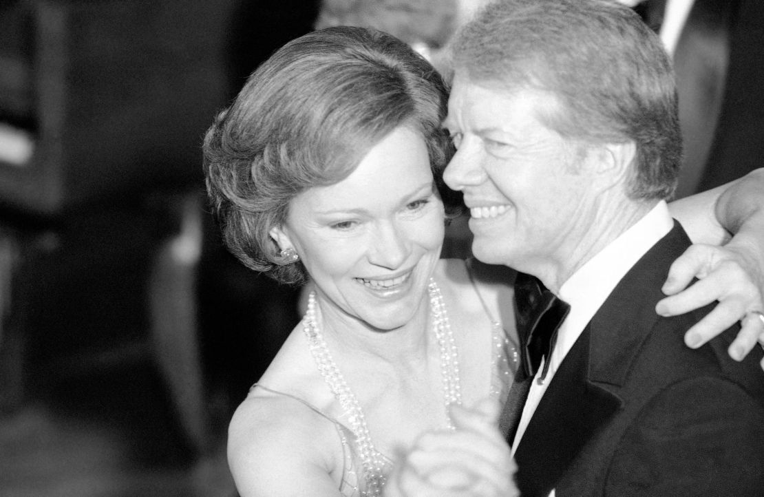 President Jimmy Carter and his wife Rosalynn lead their guests in dancing at the annual Congressional Christmas Ball at the White House in December 1978.