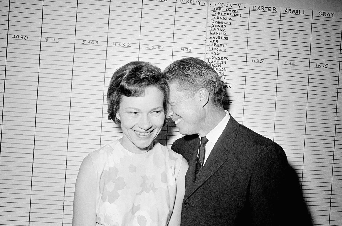 Then-Georgia State Sen. Jimmy Carter hugs his wife, Rosalynn, at his Atlanta campaign headquarters in 1966.