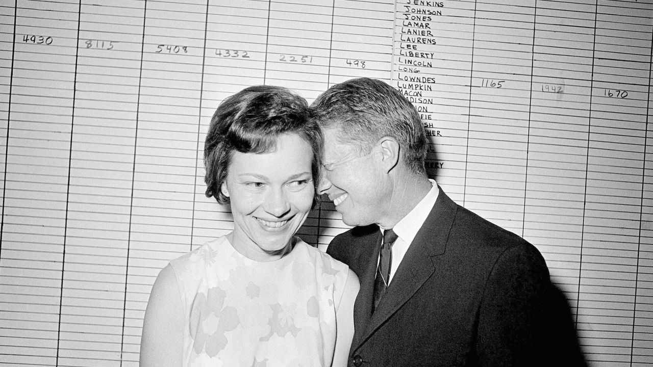 Then-Georgia State Sen. Jimmy Carter hugs his wife, Rosalynn, at his Atlanta campaign headquarters in 1966.