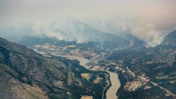 An aerial photo taken from a helicopter shows a wildfire burning in the mountains north of Lytton, British Columbia, on Thursday, July 1, 2021. (Darryl Dyck/The Canadian Press via AP)
