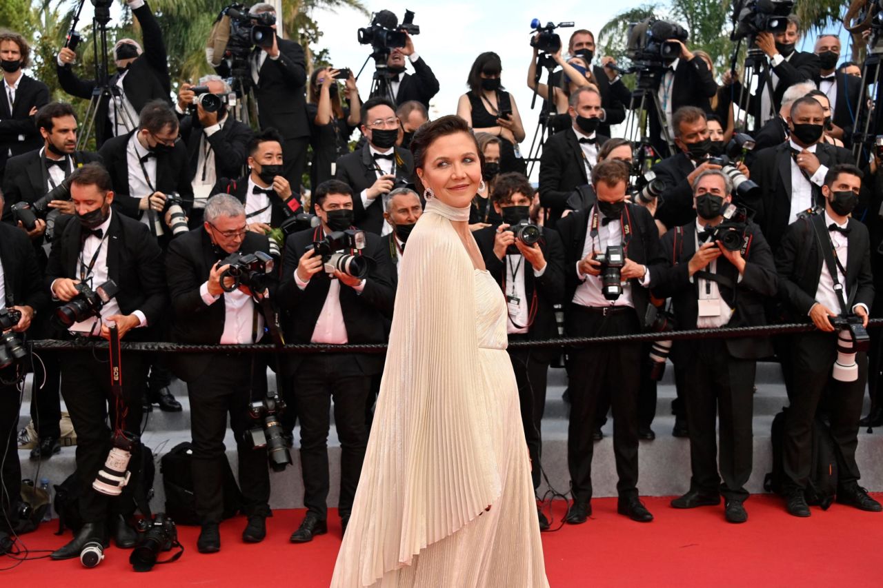 Maggie Gyllenhaal kept it classic in a nude Celine dress, complete with pleated cape.