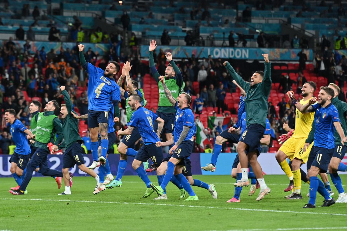 Players of Italy celebrate with their fans following the team's victory against Spain.