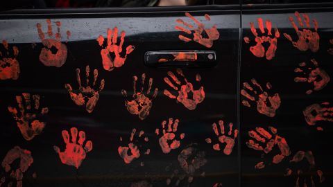 Handprints on the side of a truck riding in a convoy of vehicles in support of the Tk'emlups te Secwepemc people, after the remains of 215 children were discovered buried near the former Kamloops Indian Residential School in Canada's British Columbia, on June 5.