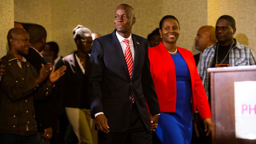 President-elect Jovenel Moise arrives with his wife Martine during his first press conference after the announcement of his victory in Petion-Ville, Haiti, Tuesday, Jan. 3, 2017. Moise, a businessman from northern Haiti who has never held political office, was certified as the official winner of the November presidential election Tuesday following a ruling by an electoral tribunal that found no evidence of large-scale voter fraud. (AP Photo/Dieu Nalio Chery)
