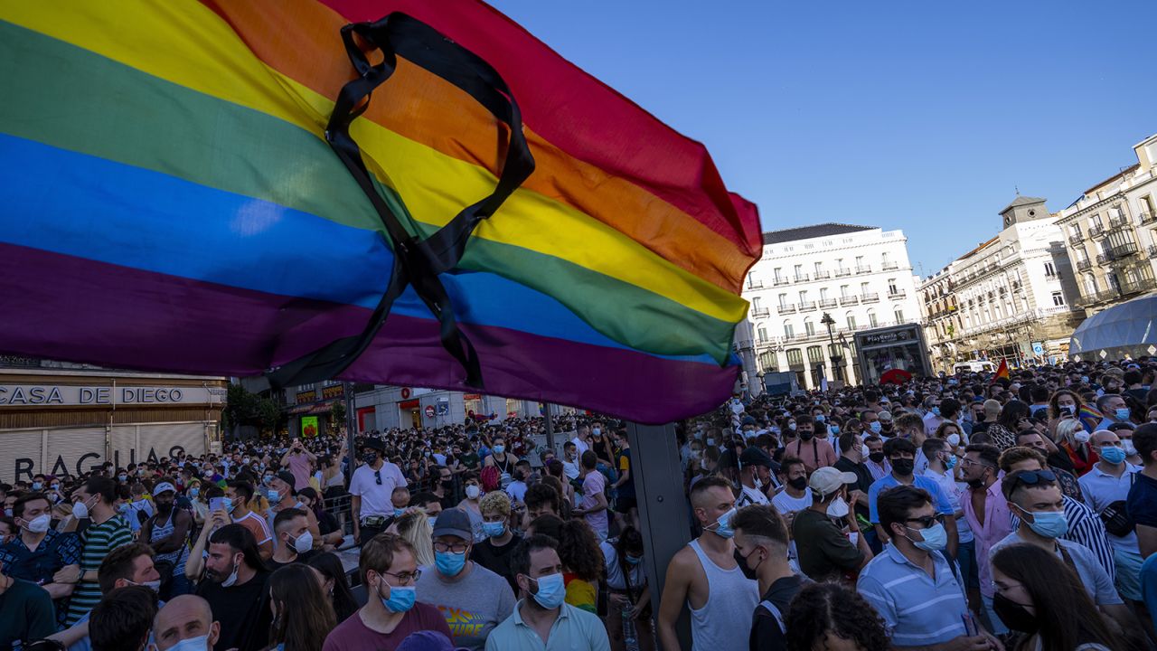 The rainbow flag with a black ribbon flutters during a protest against Luiz's killing in Puerta del Sol, central Madrid, on Monday, July 5.