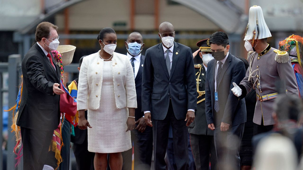 Haiti's President Jovenel Moise (C) and his wife, First Lady Martine Moise (2-L), arrive at the National Assembly to attend the inauguration of Ecuadorean President-elect Guillermo Lasso, in Quito on May 24, 2021. (Photo by Rodrigo BUENDIA / AFP) (Photo by RODRIGO BUENDIA/AFP via Getty Images)