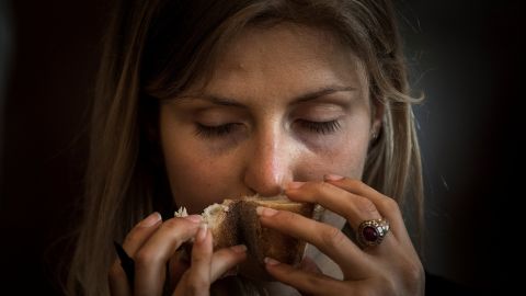 A member of the jury smells a baguette as part of Paris' baguette Grand Prix in 2017.