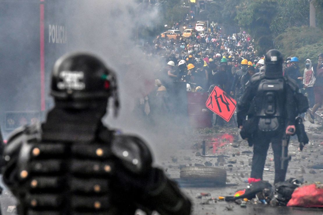 Riot police clash with protesters in Medellin, Colombia, on June 2.