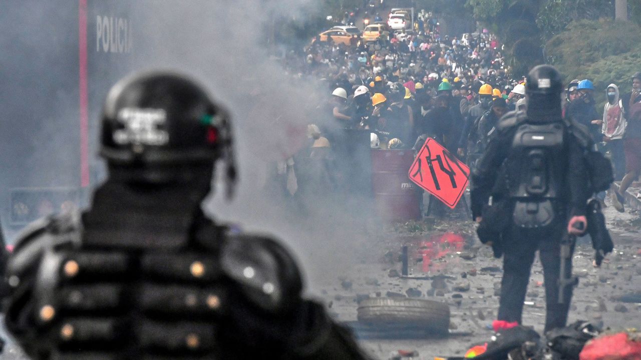 Riot police clash with protesters in Medellin, Colombia, on June 2.