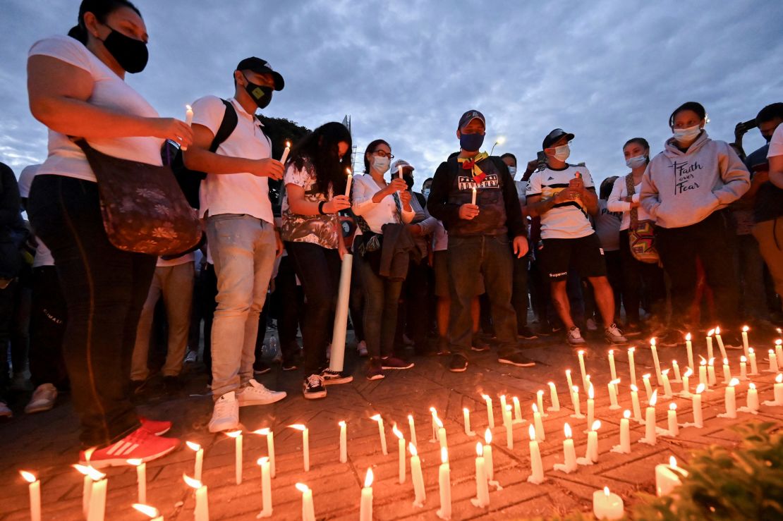 Laura Guerrero, mother of Nicolas Guerrero, who was killed during clashes with riot police at a protest against a tax reform bill, attends with her husband a vigil in honor of their son, in Cali, Colombia, on May 3, 2021. 