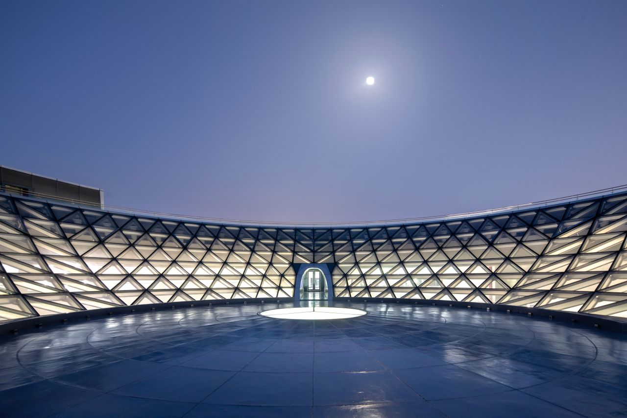 The inverted glass dome offers visitors the chance to gaze at an unobstructed view of the open sky.