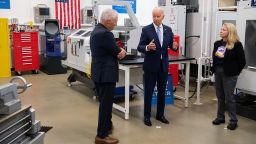 President Joe Biden speaks with Heather Zaccagnini, right, Applied Technology Department co-chair, and college president Dr. Clint Gabbard during a tour of a manufacturing lab at McHenry County College in Crystal Lake, Illinois, on Wednesday July 7.