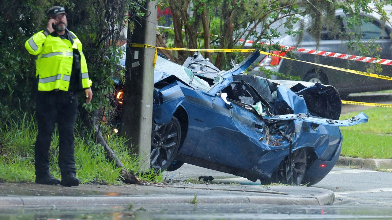 This was one of two vehicles hit by a large pine tree that fell across the road during strong wind bands from Tropical Storm Elsa late Wednesday afternoon in the Ortega area of Jacksonville, Florida.