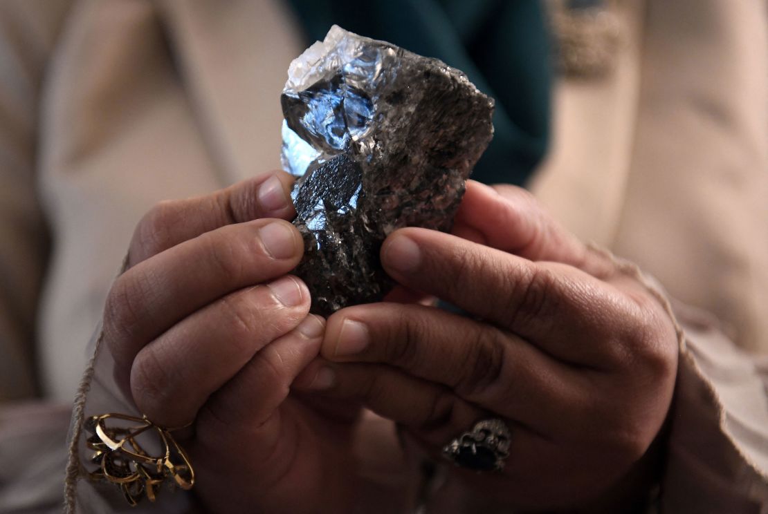 A member of the Botswana cabinet holds a 1,174-carat diamond in Gaborone, Botswana. 
