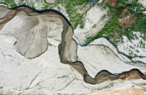This aerial photo shows the San Gabriel River and the exposed lake bed of the San Gabriel Reservoir near Azusa on June 29.