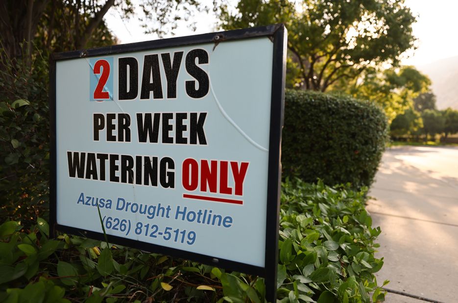 A sign is posted about watering limits in Azusa, California, on June 29.