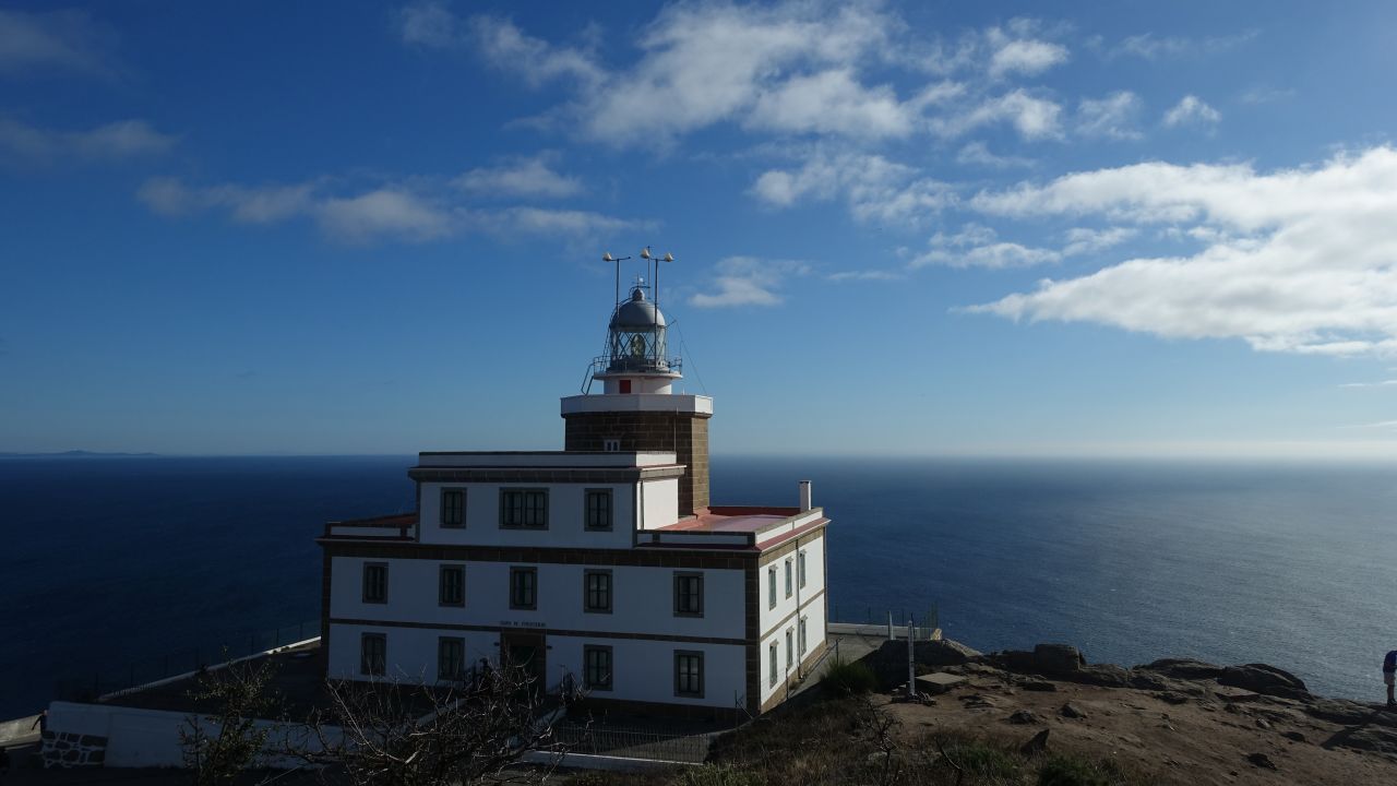 <strong>Camiño dos Faros:</strong> Cape Finisterre Lighthouse occupies a dramatic perch. It was built in 1853 and marks one end of the coastal hiking route called Camiño dos Faros in Galicia, Spain. 