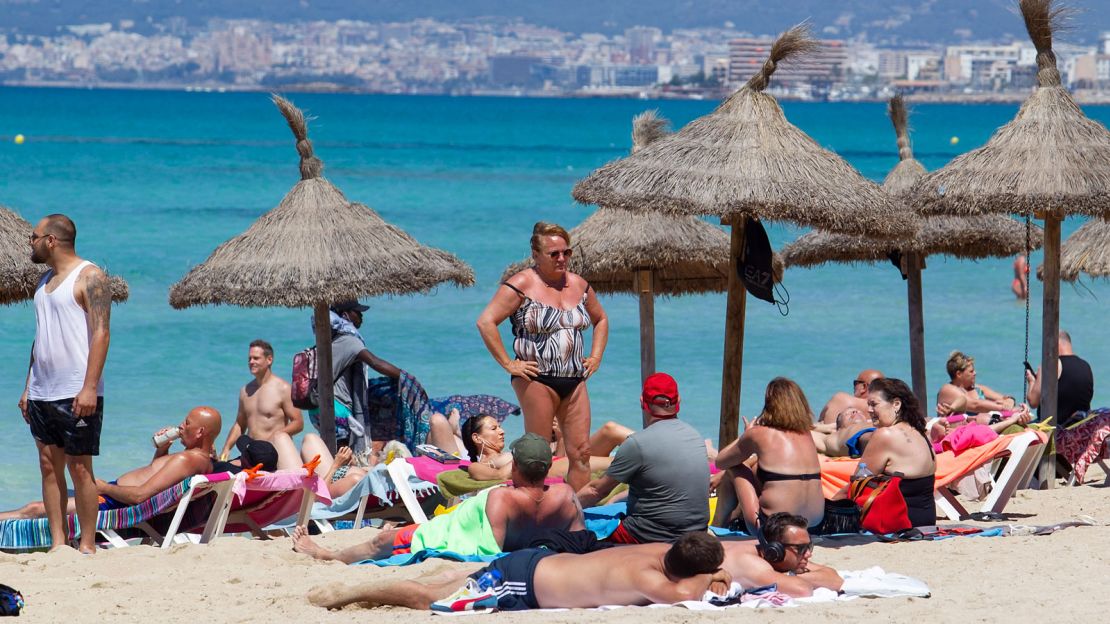 Mallorca (also spelled Majorca) is the No. 1 trending travel spot for 2022. Here, tourists enjoy Palma Beach.