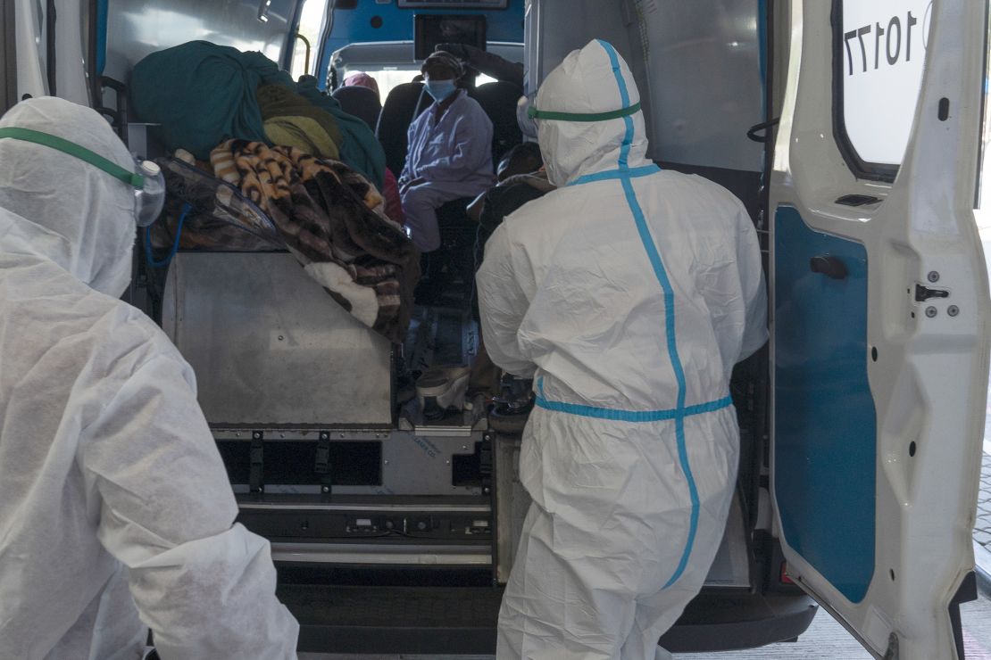 Health workers arrive with a patient at the Chris Hani Baragwanath Academic Hospital's COVID-19 facility, in Johannesburg, Monday, June 21, 2021. 