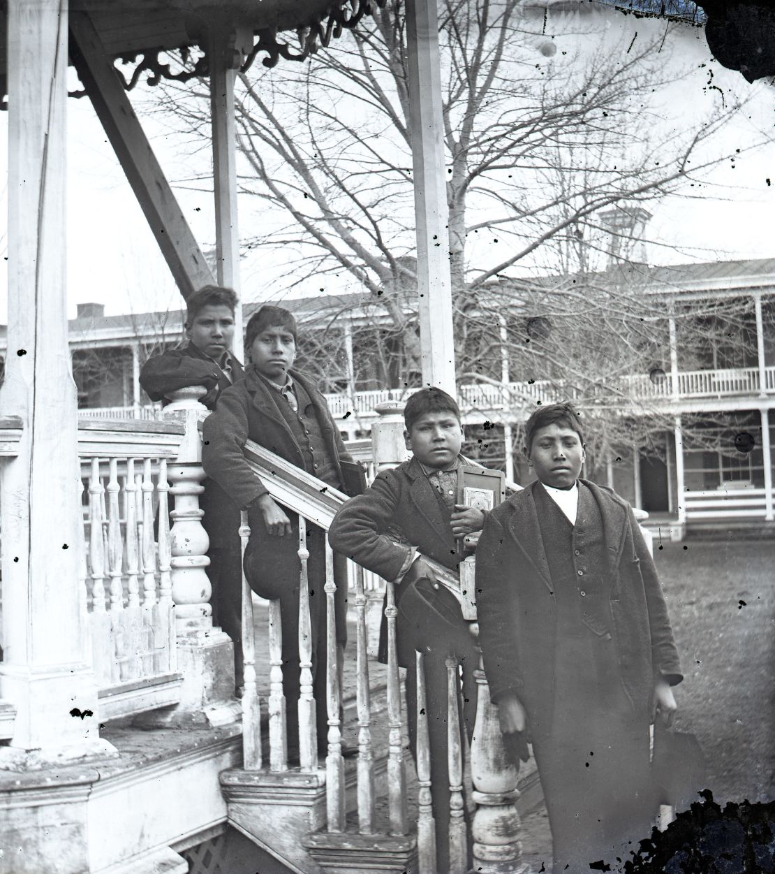 Four male students posed on the grounds of the Carlisle Indian Industrial School in 1879. The remains of Dennis Strikes First (Blue Tomahawk), second from left, will be repatriated to the Rosebud Sioux reservation next week.