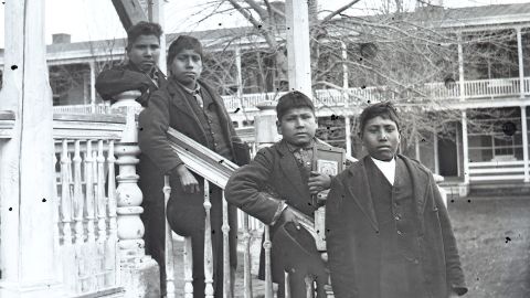 Four male students posed on the grounds of the Carlisle Indian Industrial School in 1879. The remains of Dennis Strikes First (Blue Tomahawk), second from left, will be repatriated to the Rosebud Sioux reservation next week.