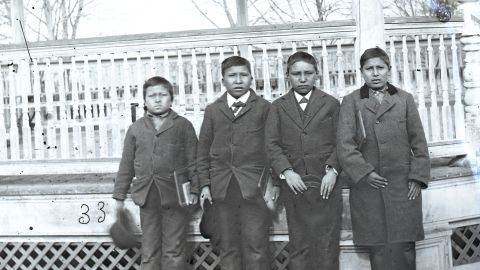 Four boys posing for a photo on the grounds of the Carlisle Indian Industrial School in 1879. Alvan Kills Seven Horses (One That Kills Seven Horses), second from left, was buried there and his remains are among those that will be repatriated to the Rosebud Sioux reservation next week.