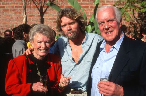 Branson poses with his parents, Eve and Edward, at a reception in Los Angeles in 1991. His mother was a flight attendant and his father was a lawyer.