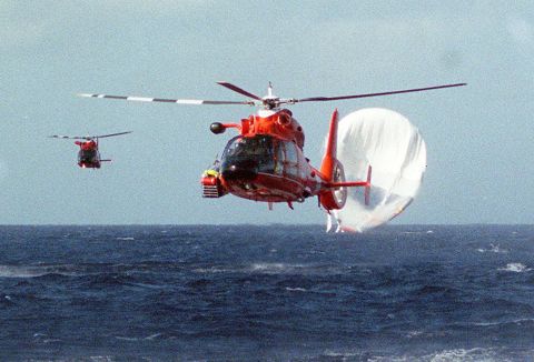 US Coast Guard helicopters head back to the Barbers Point Naval Air Station in Hawaii after rescuing Branson and his co-pilots following a hot-air balloon crash in 1998. Branson and his co-pilots were attempting to fly around the world in a hot-air balloon. They started in Morocco and passed through Asia before eventually crash-landing in Hawaii. No one was hurt.