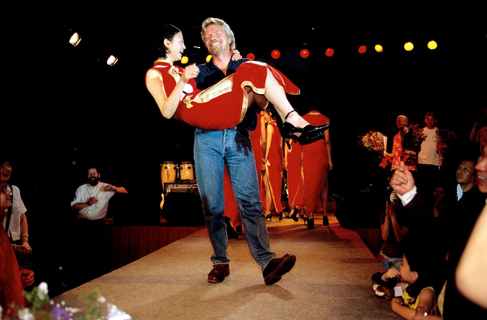 In 1999, Branson celebrates Virgin Atlantic's inaugural flight to Shanghai, China.