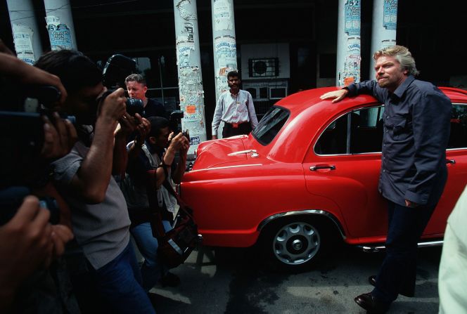 Branson poses for photos in India after launching a direct flight from London to New Delhi in 2000.
