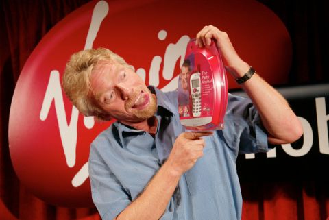 Branson launches Virgin Mobile USA, a cellular phone service, at New York's Times Square in 2002.